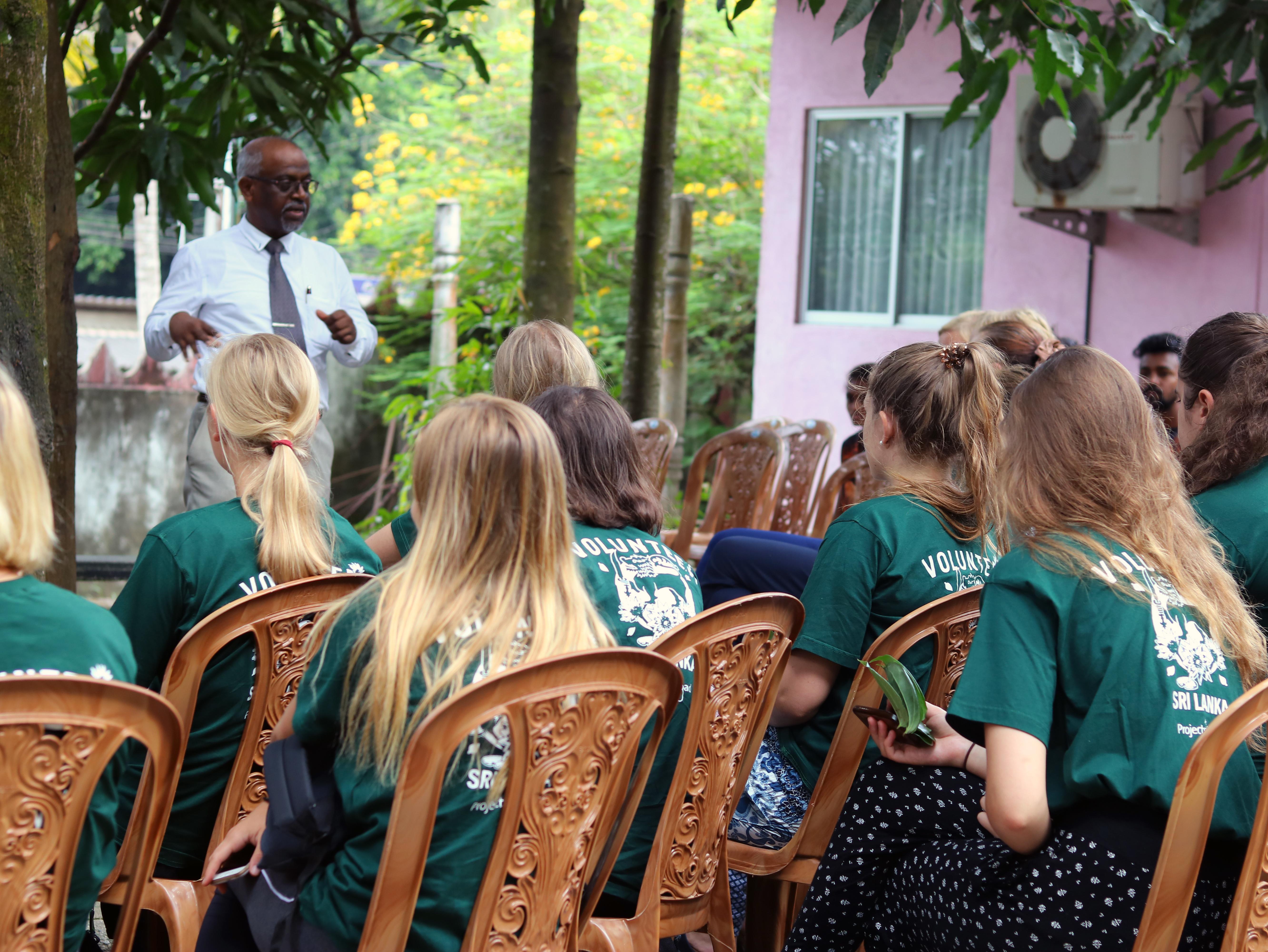Healthcare volunteers listen to a professional during a medical workshop in Sri Lanka Volunteers prepare for a workshop during their volunteer project abroad