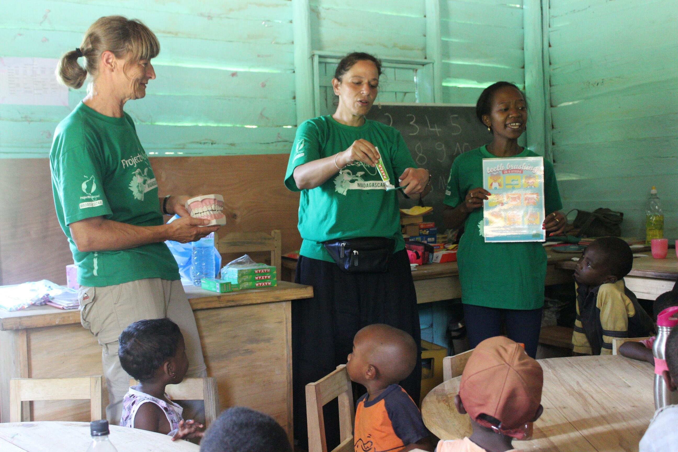 Grown-up Special volunteers run a class at the early childhood development centre as part of their retired volunteer opportunity Older Projects Abroad volunteers teach a class to their students in Madagascar