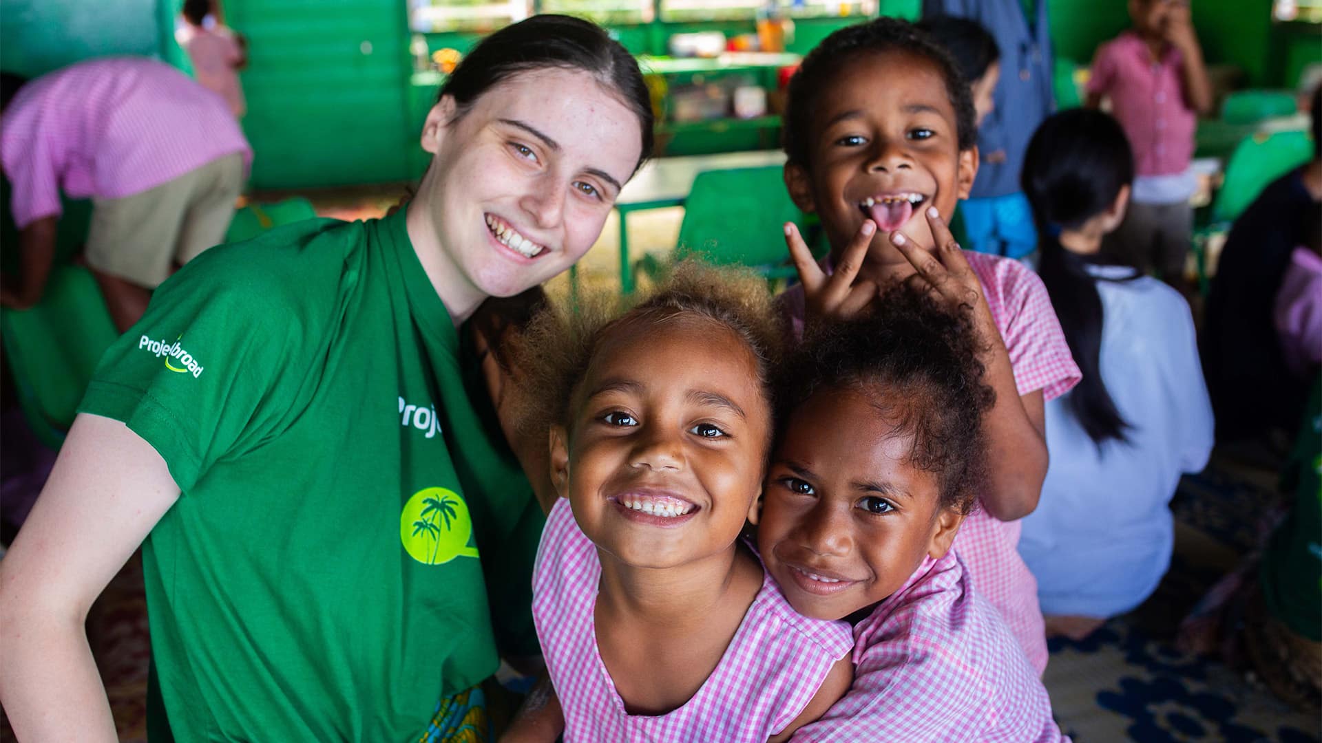 Fiji Volunteer and Children Smiling