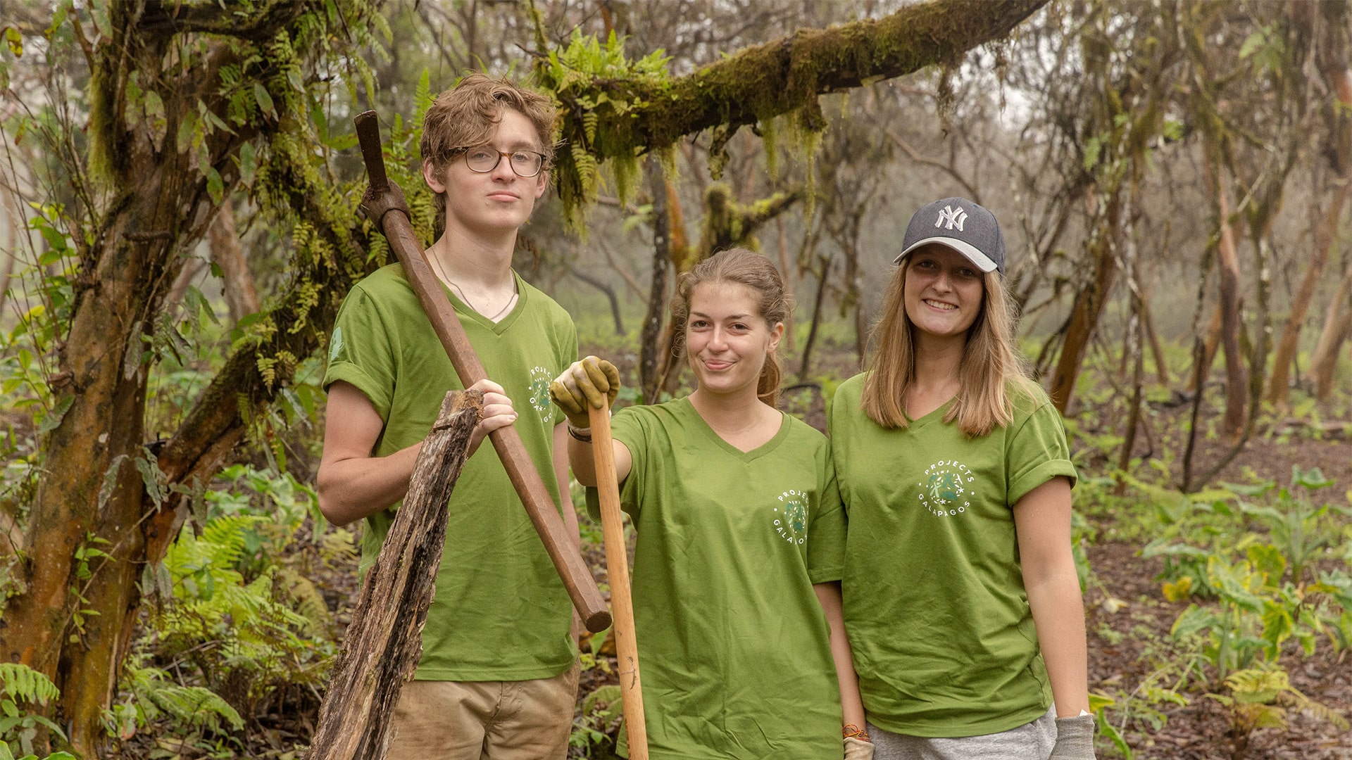Galapagos Teens Holding Tools