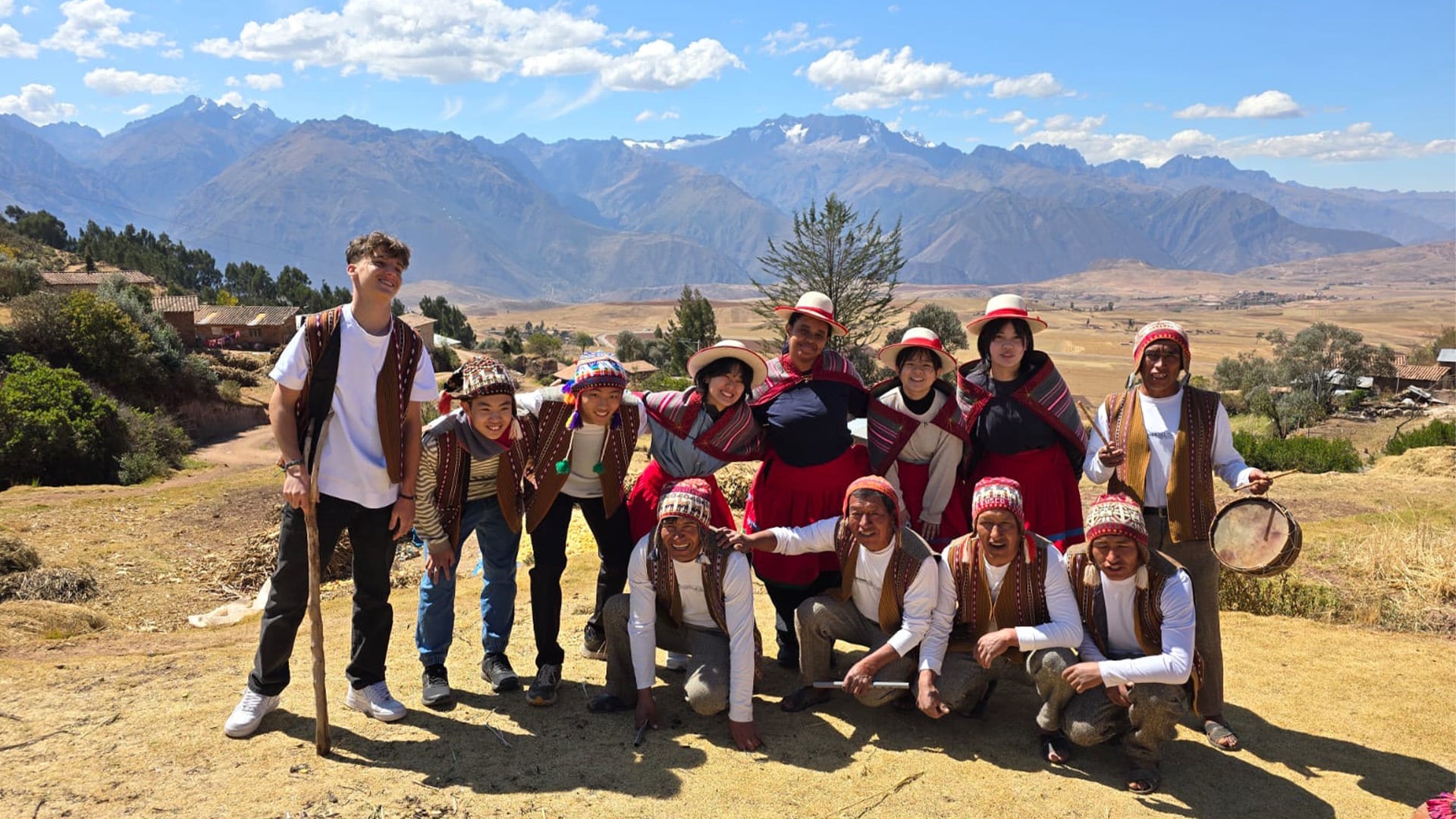 Group in Peruvian Clothing by Mountains