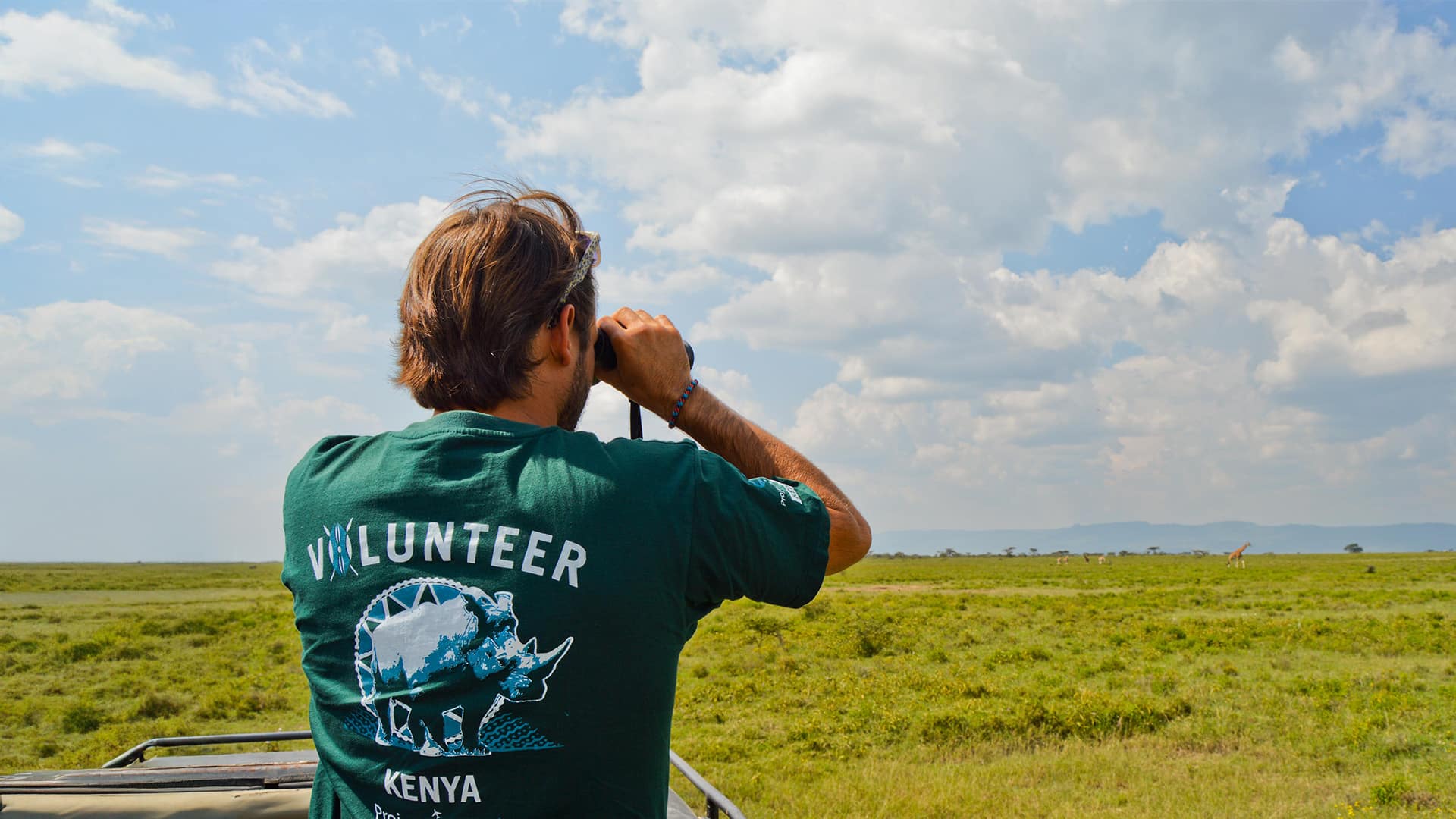 Kenya Conservation Volunteer With Binoculars