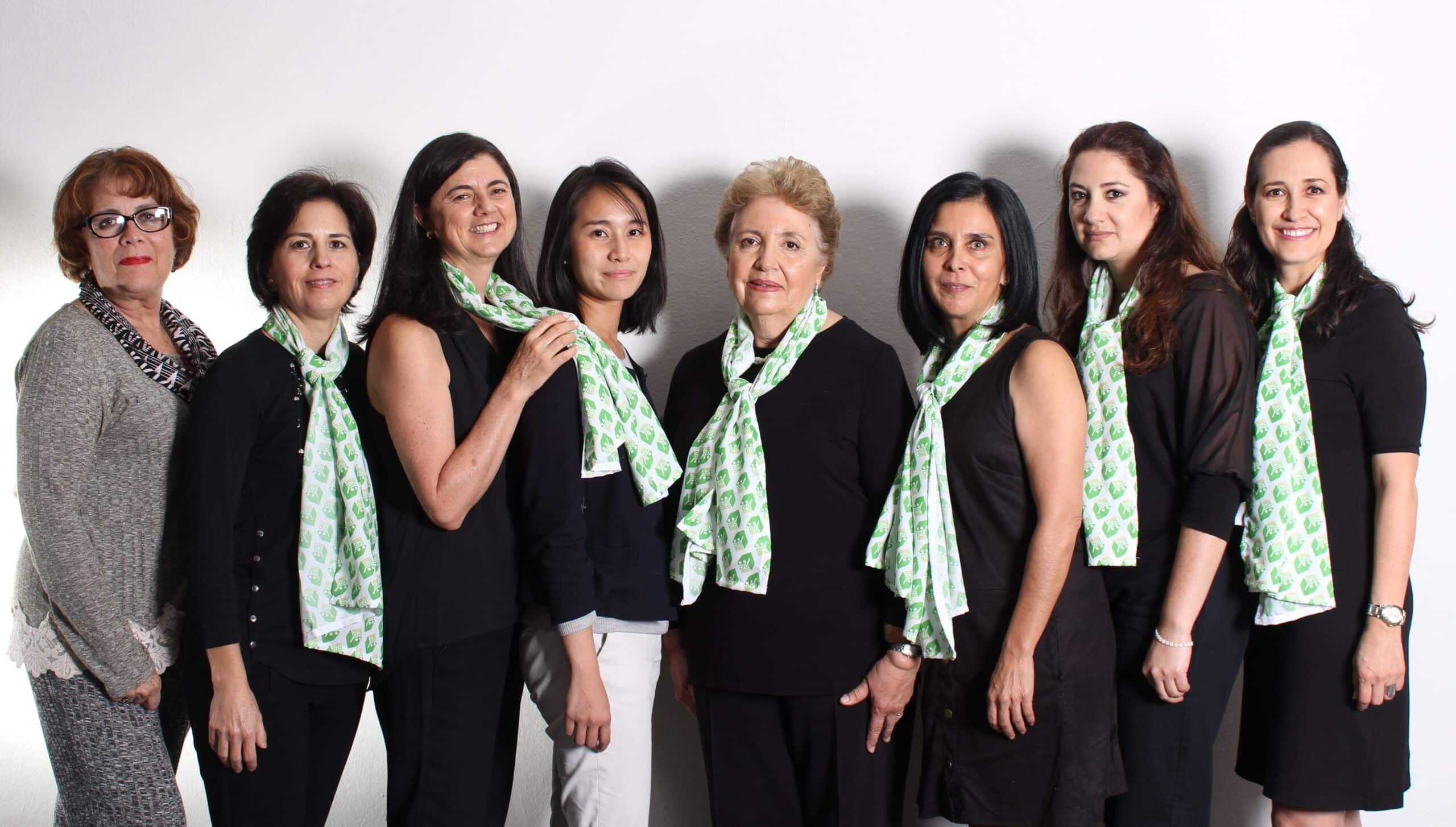 Female Business staff stand in a line with Projects Abroad interns on their Businnes Work Placement in Mexico.