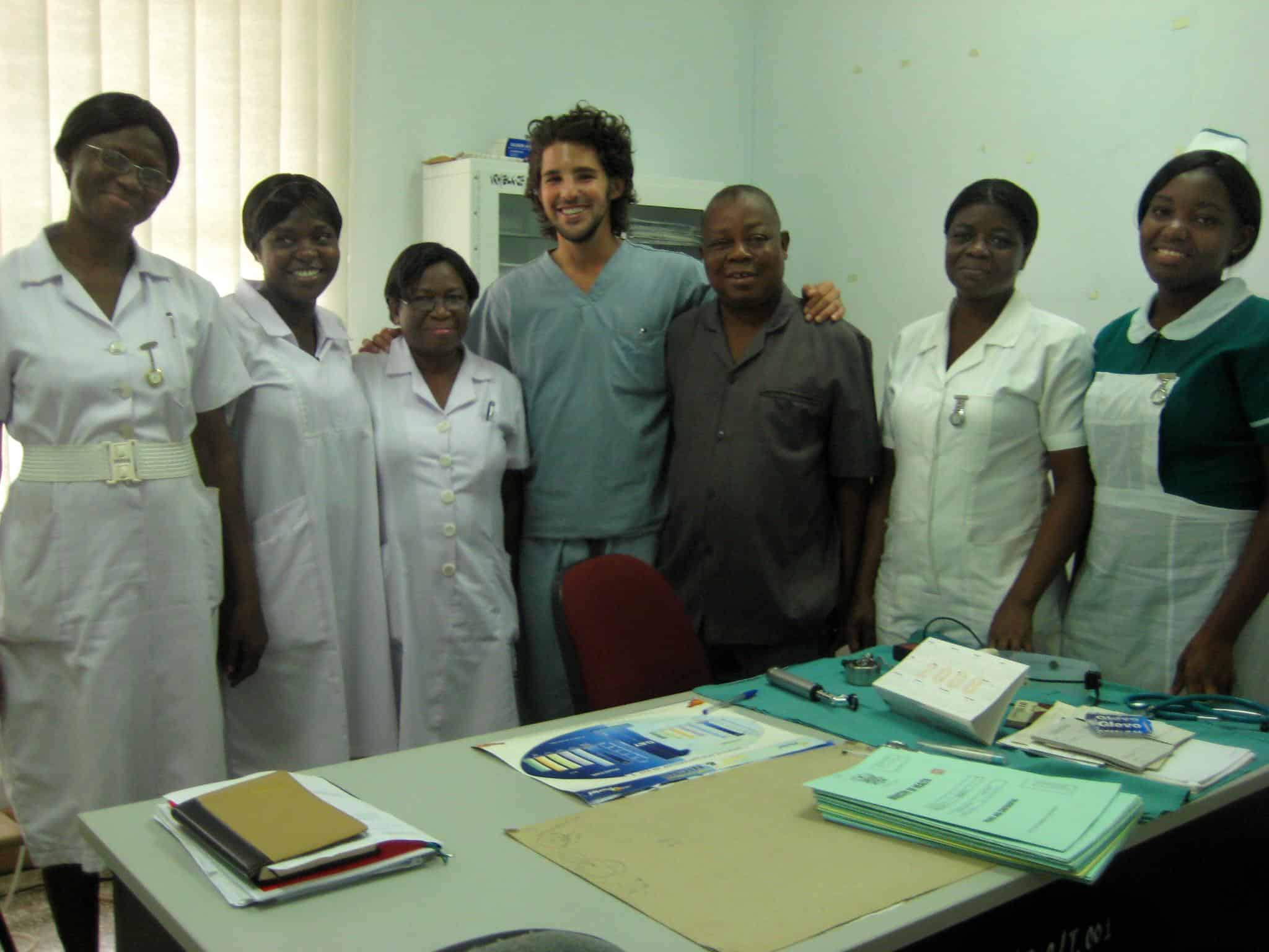 An intern on a Dentistry Project in Ghana with local medical staff at a clinic.