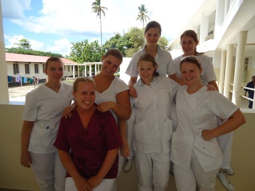 Projects Abroad Dentistry interns pose with a local healthcare staff member during their Dentistry placement in Tanzania.