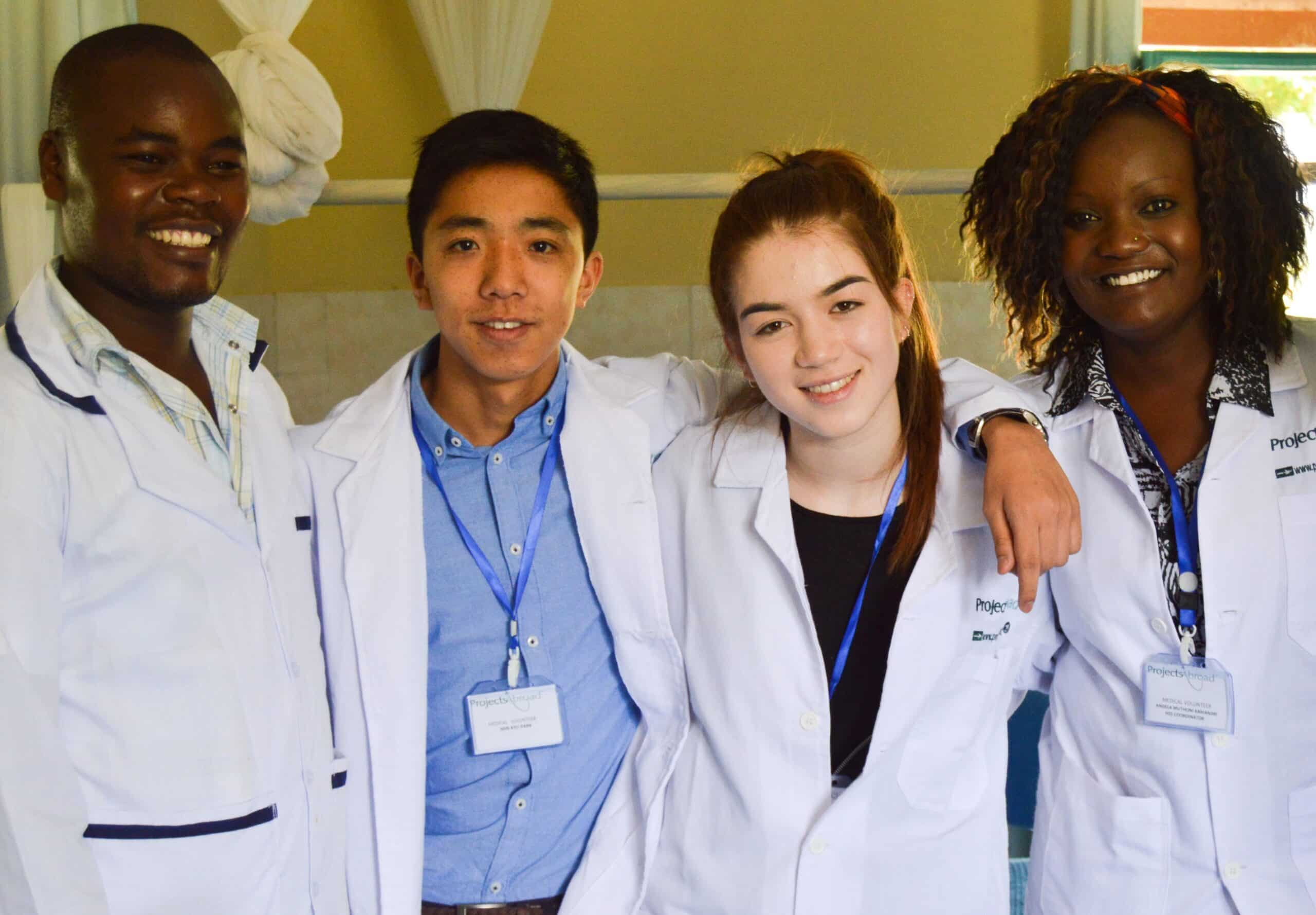 Interns from Projects Abroad take a photo with local doctors whilst on their nursing work experience in Kenya.