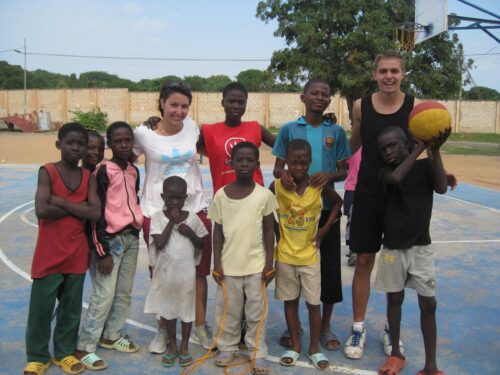Projects Abroad volunteers teach basketball in Ghana to a group of children