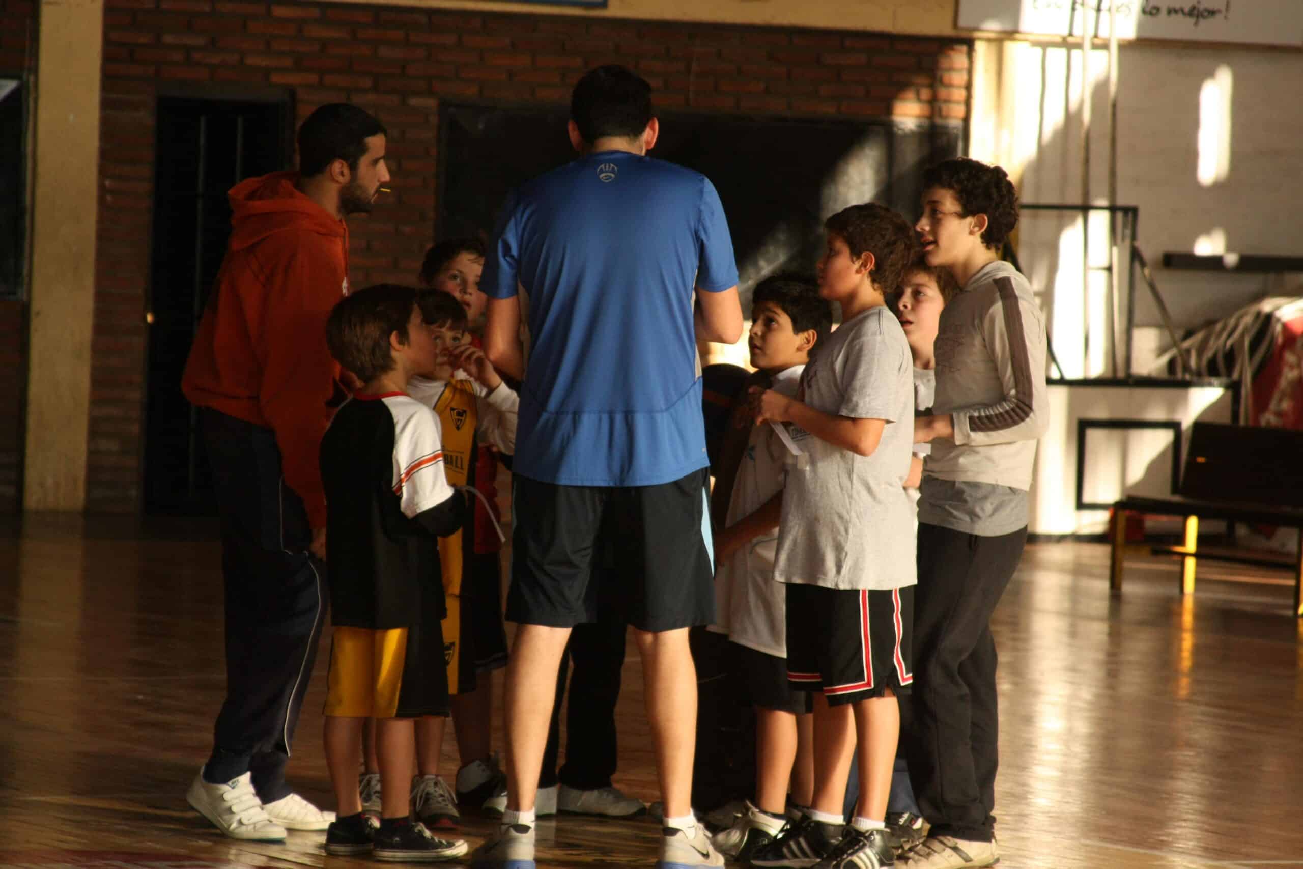 A sports player meets with his team as part of his volunteer sports coaching in Argentina