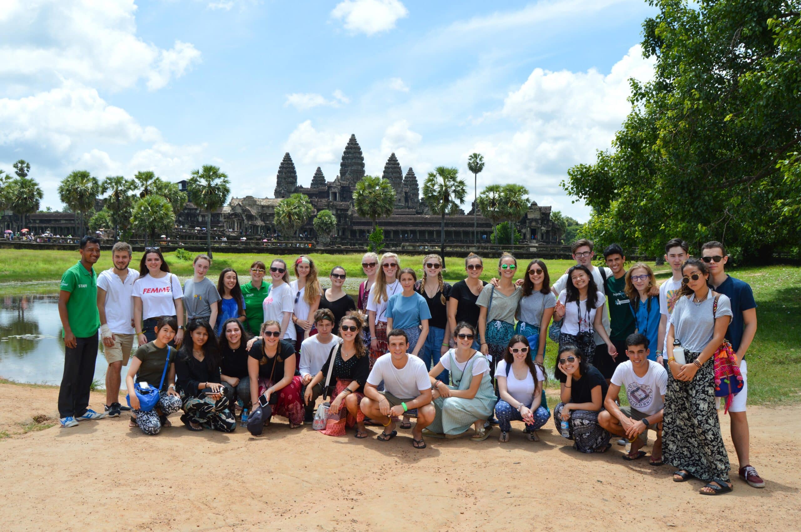 A diverse group of volunteers on a volunteering overseas project without requirements.