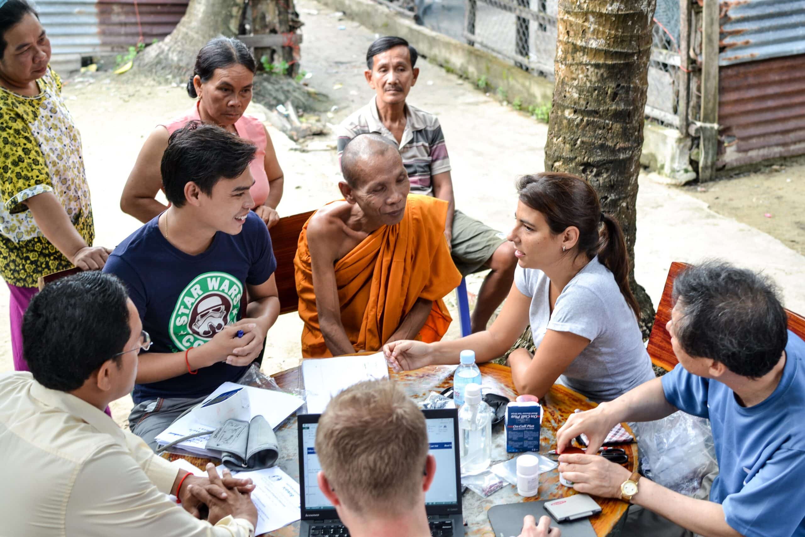 Public Health volunteer speaks to the locals to get some tips for learning their language while abroad.  A Public Health intern breaks the language barrier during her project in Cambodia, as part of cultural exchange.