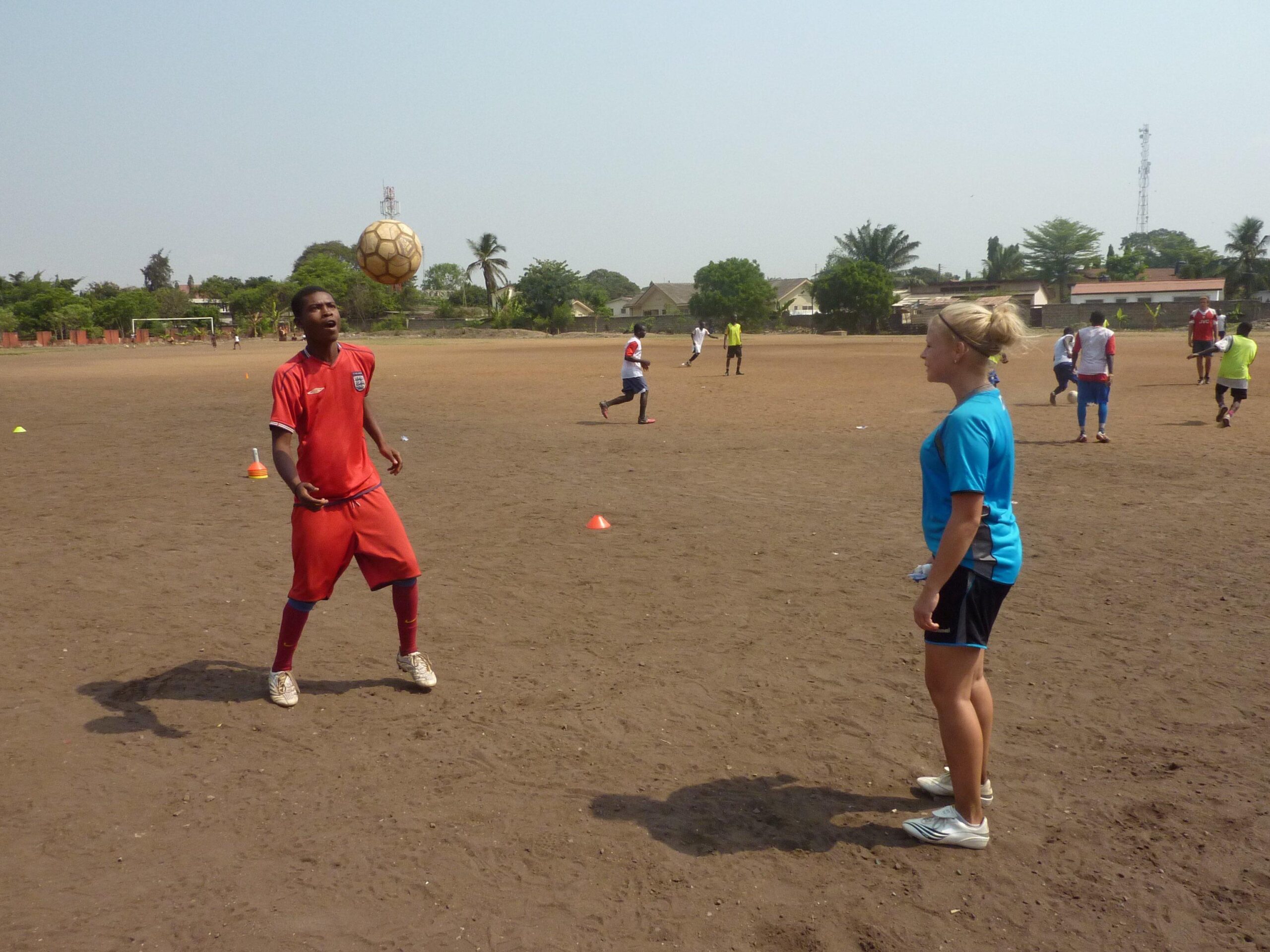 Projects Abroad High School volunteer practices football techniques in Ghana during her Football Coaching project.