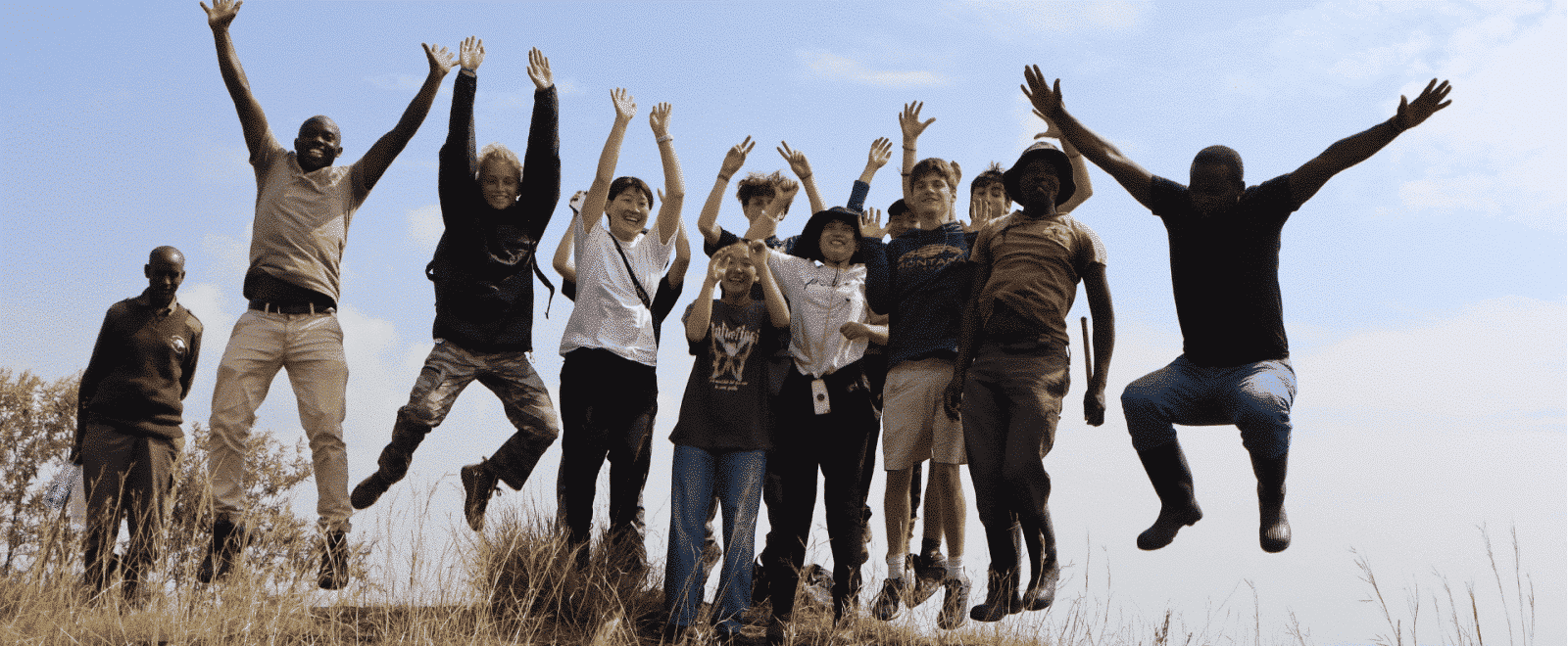 A group of volunteers jumping for joy in Kenya