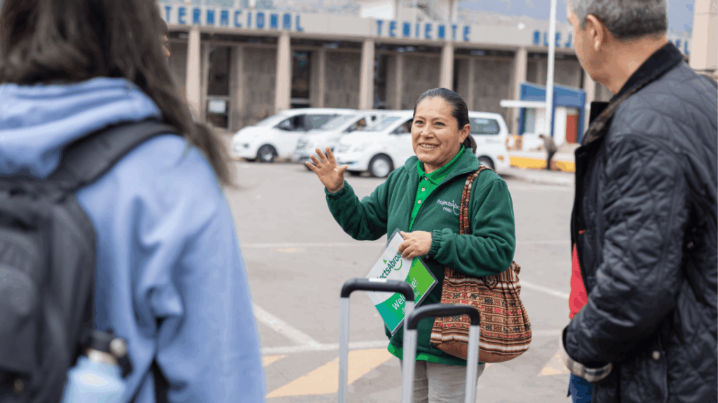 Staff welcoming a new volunteer at the airport in Peru