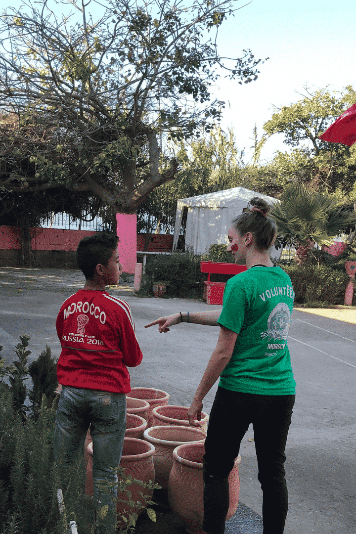 A volunteer in Morocco talk with a local child